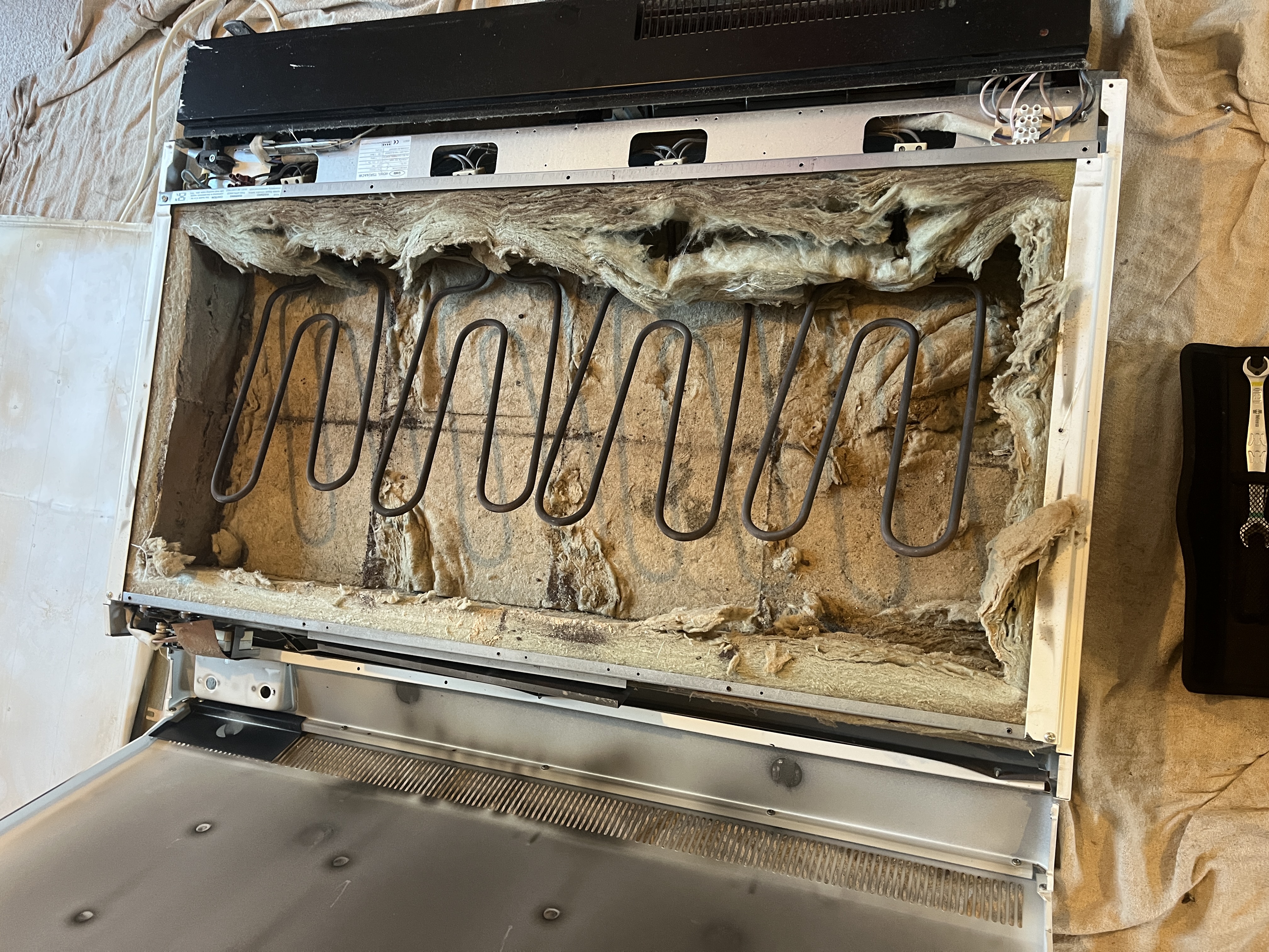 Inside a night storage heater - deteriorated wiring